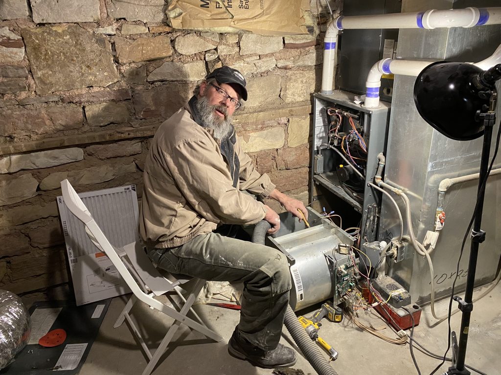 Mike repairing water heater